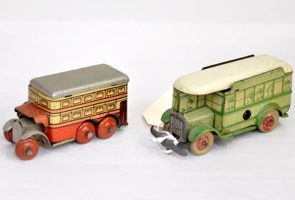 2 Small German Bus Toys: 3" red litho tin double-decker bus, mechanism functions with turning action, key; 4" Tipp & Co green tin litho bus. Mechanism functions with table-edge stop mechanism. Both are well made and in nice c