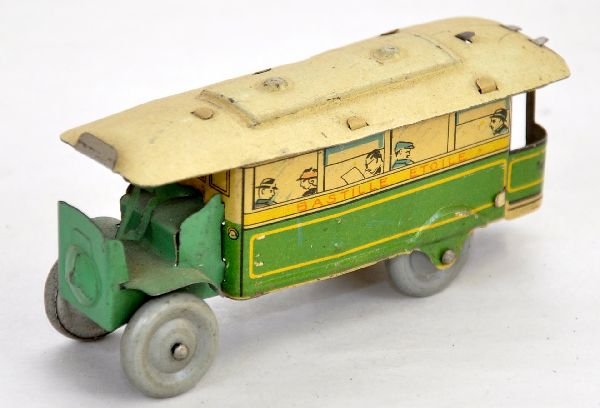 Early French Penny Toy Omnibus: Marked C.R. France, 3 1/2" litho tin bus with driver & lithoed passengers, side reads Bastille Etoile. It is fairly clean & shiny, showing light to moderate playwear, C7-7+