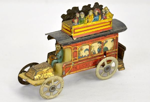 Nice German Meier Omnibus Penny Toy: 3 1/4" long with super tin litho with passengers on top & screened on sides, reads "The Electric Omnibus". Appears to be missing its motion roller, but may have been a static version. It is clean with