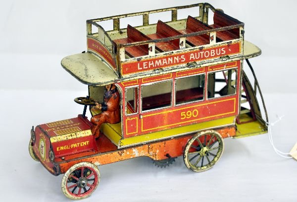 Early Lehmann Autobus Toy: 8" litho tin with driver & interior & top seats. Mechanism is incomplete, missing intermediate gear set, steers via steering wheel. It is fairly clean with bright litho & shows moderate playwear, C6-6