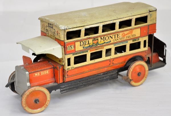 Scarce Tipp & Co Omnibus Toy: 10 1/2" long, litho tin with driver & upper level seats. Great advertising litho for Dunlop & Wincarnis and side window ads are actually in reverse as to be read from the inside. It has a functional m