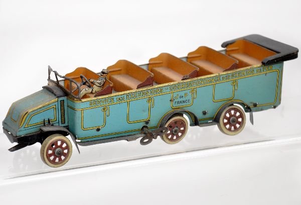 Rare Jep Open Tour Bus Toy: 1st we've seen! 10" long, litho tin with driver & seats. Mechanism does not function, but appears complete. Unusual steering front moves rear wheels as with a fire truck. Clean, bright litho, with som
