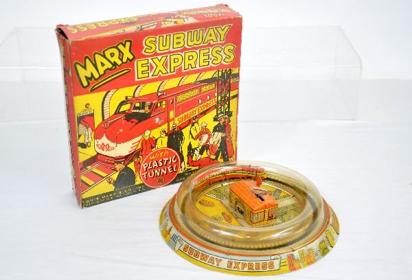 Boxed Marx Subway Express: Unusual version of this classic toy. The plastic bubble is clean and not warped for a change. The mechanism functions with assistance, but needs lubrication. It is bright and fairly clean with a nice 