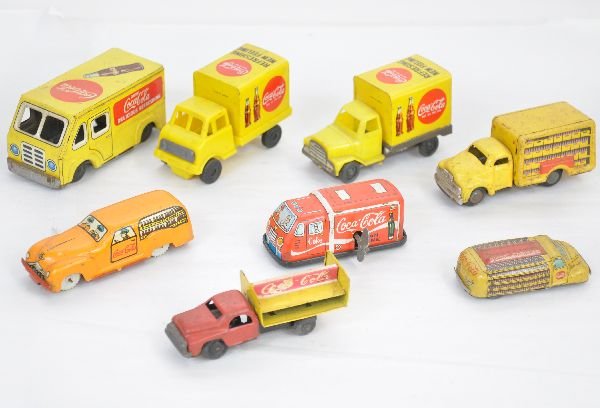 8 Small Tin Coca-Cola Trucks: Nice assortment of pre 1969 Coke toys. Largest is 3". All need a good cleaning to grade C7-8 or better