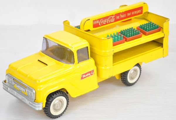 Buddy L Coca-Cola Truck: Circa 1962. 15" long painted & decaled pressed steel. Coke decals are 95% over-all. It is clean & shiny with 7 soda crates, not original to truck, but well scaled. It shows light playwear, C7+