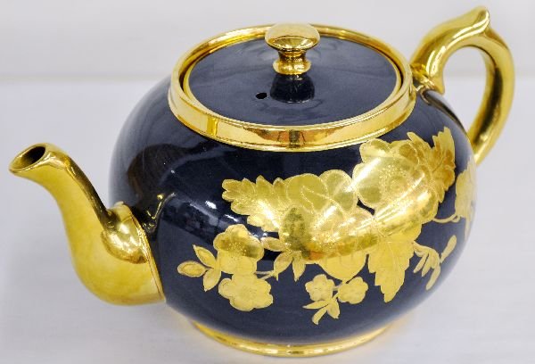 Fine Gibson Teapot: England, china, circa 1940s. Beautiful glaze with gold leaf details. It is stamped on bottom with painted style numbers. Shows no wear. Examine photos or call for more information, 203-730-1404