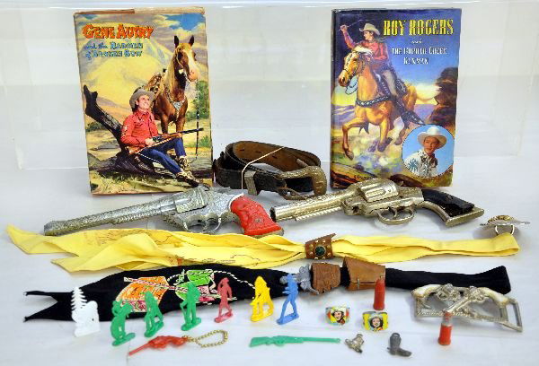 Western Toy & Book Lot: Includes Roy Rogers & Gene Autry books in great shape; Kilgore Peace Maker cap gun, broken handle; Hubley Kit Carson Cap pistol, cracked handle; 2 neckerchiefs; leather cap pistol belt; belt buckle, s