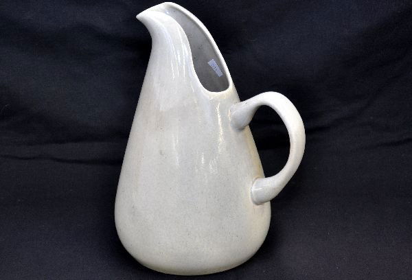Russel Wright Pottery Pitcher: 10 1/2" open form pitcher with applied handle. Gray special glaze with no chips or flakes, signed on bottom. Examine photos or call for more information, (203) 730-1404