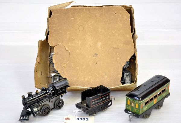 Boxed American Flyer Train Set: Circa 1922. 11 steam loco; 120 tender; 1206 4-wheel lightning bolt coach. All show moderate playwear with track & rough set box, C6-6+