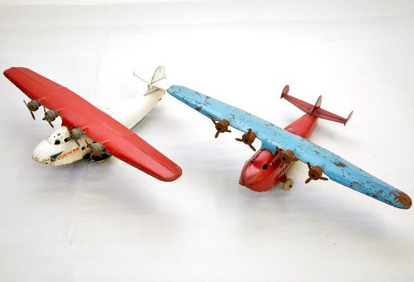 2 Wyandotte China Clipper Airplanes: Painted pressed steel, 13" wing span. Circa 1930s. One is Pan American China Clipper flying boat. It has nice decals with some surface oxidation. Shows light playwear, C6; Other is generic version wit