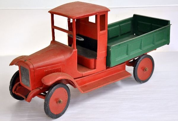 Early Buddy L Dump Truck: Circa 1920s closed cab. Very early restoration. Back bed from different truck. Displays well.