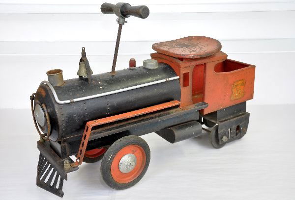 Keystone 6400 Ride On Locomotive: Circa 1930s. Painted & decaled pressed steel, 25" long. Complete with nice decals. The whistle bellows is dry so no sound. It shows moderate playwear and should clean to C5-6