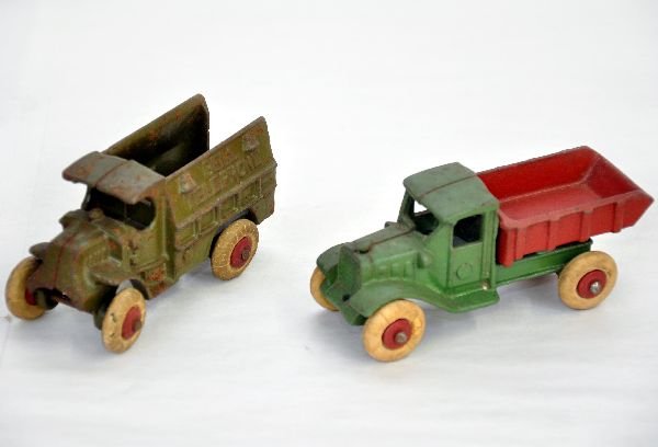 Hubley Iron Telephone & Dump Trucks: 4" C-Cab Mack telephone truck & 4 1/2" International dump truck. Both have hubbed wheels and show moderate playwear. They should clean-up to C5-6
