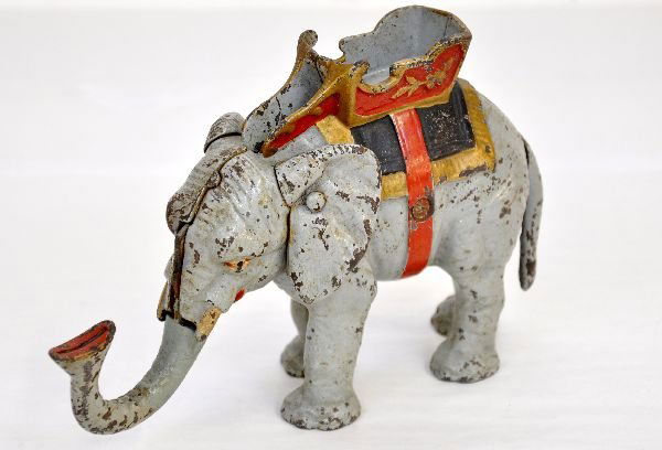 Hubley Elephant With Howdah Mechanical Bank: 9" long, painted cast iron. Clean with shiny paint. Mechanism needs a spring (or reconnect spring), so not functioning. It retains 88% of its original paint and is intact