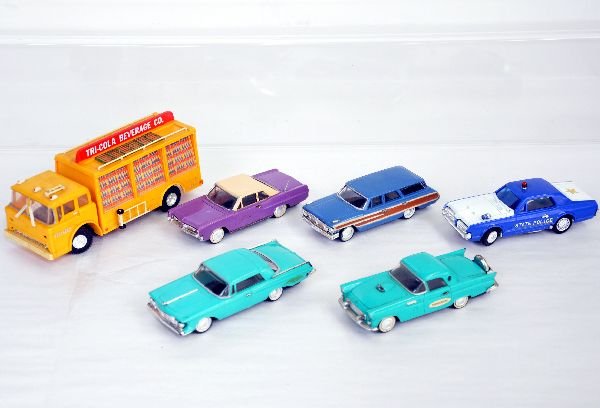 6 Ideal Motorific 1960s Slot Cars: Battery op about 1:43 scale. Includes Ford T-Bird; Chrysler Imperial; scarce Purple Pontiac Grand Prix; Ford station wagon; Scarce Cougar state police car on computer chassis; Action Highway Cola truc