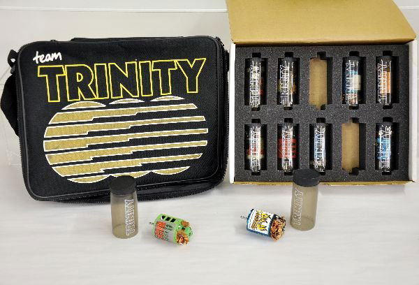 Team Trinity Assorted Motor Set in Carrying Case: 10 Trinity electric motors in original protective plastic tubing in original carrying case. Motors appear to have been used but all appear functional. Carrying case shows little to no wear.