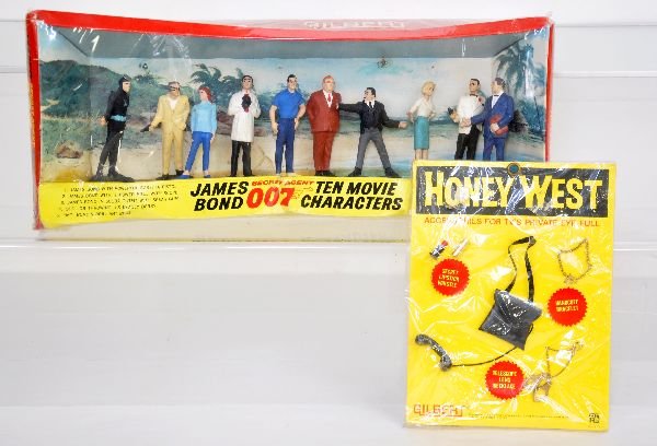 2 AC Gilbert 007 Toys: Includes 16525 10-character pack, sealed in box. Plus a 16267 Honey West Accessory pack, sealed on card, C10