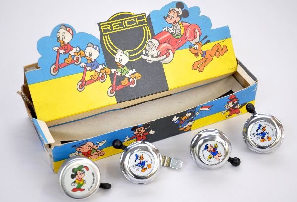Boxed Reich Disney Bicycle Bell Display: Includes 4 of 10 bells, with 2 Donald Duck; Mickey Mouse & 1 of 3-Little Pigs. Bells are like new with worn display box & insert with great graphics, bells are C9
