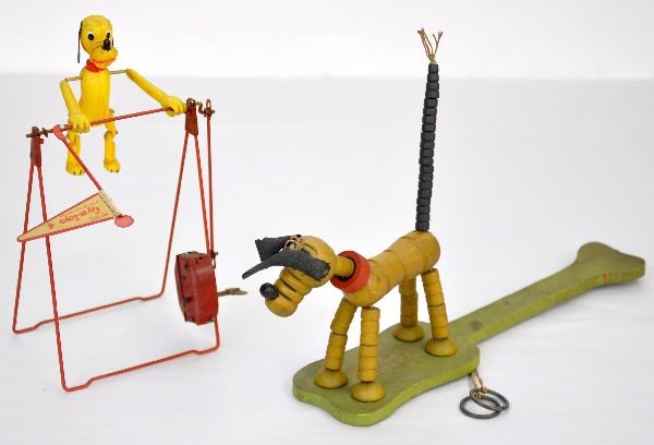 2 Vintage Disney Pluto Toys: Marx Line Mar Celluloid Pluto Acrobat, 9" tall, mechanism functions and shows light wear, C8; Fisher Price Pluto finger puppet on wood base. It is dirty, but shows light wear, C7ish