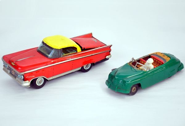 2 Marx Changeable Cars: Green Plastic windup car, 7 1/2", mechanism functions, interior flips over for hard-top look; 9" litho tin Buick Invicta, friction, roof retracts when rolled. Both show light playwear, C7-8