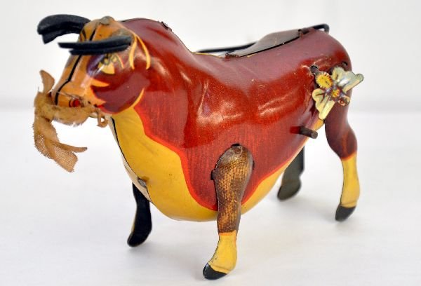 Marx Disney Ferdinand the Bull: Litho Tin, mechanism is functional with original flower & bee. The litho has dramatically different halves and original horns. It shows very light wear, C8
