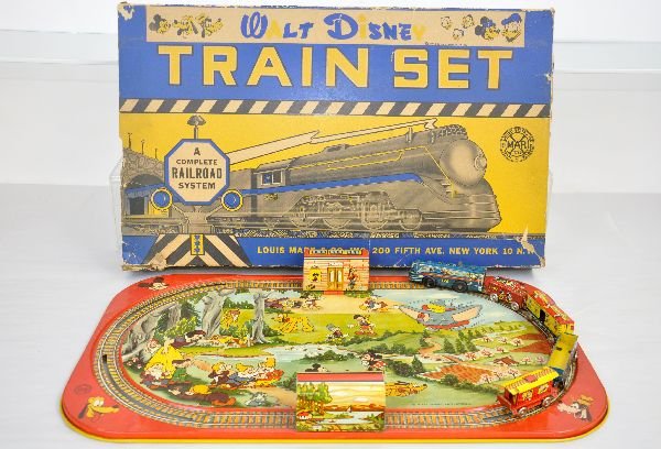 Boxed Marx Walt Disney Train Set: 21 1/2X13" litho tin platform with a 5pc Ranger style tin train set. Mechanism functions. Litho is clean & shiny showing light wear with box missing flaps, C8