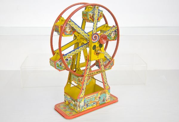 Chein Disneyland Ferris Wheel: Nice Mickey Mouse variation. Litho tin, 101/2X5X17". Mechanism functions. It is bright and shiny. It shows light to moderate playwear and should clean to C7 or better