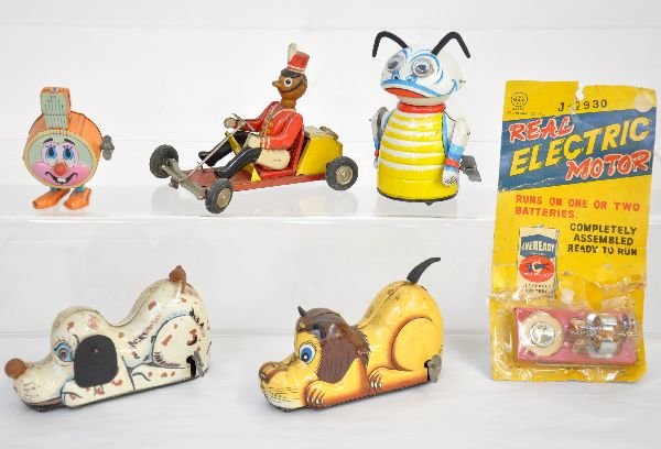 6 Assorted Marx Toys: Includes a carded Line Mar Real Electric Motor, card worn; 6" Line Mar Stalking Lion & Puppy; Moon Creature; All tin Marxie Banjo; Soldier on go cart. All mechanism function and all show light playwea