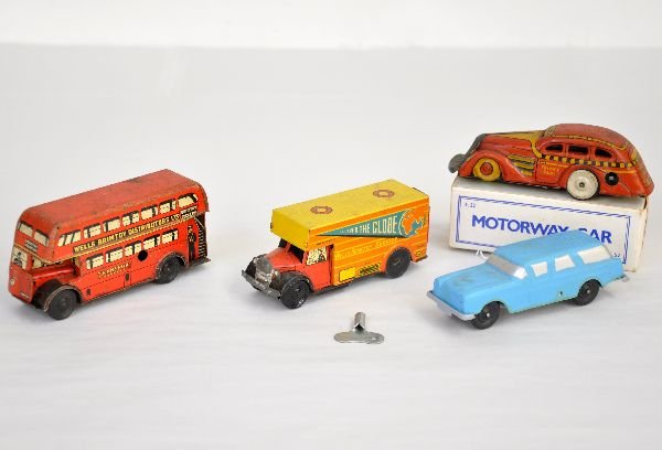 4Pc Vehicle Lot: Includes 4 1/2" Well Brimtoy bus, mechanism functions, C5; Wells friction moving van, C7+; Boxed Marx plastic Motorway car, functioning with key, C8; Marx Tricky Taxi, functioning, C6