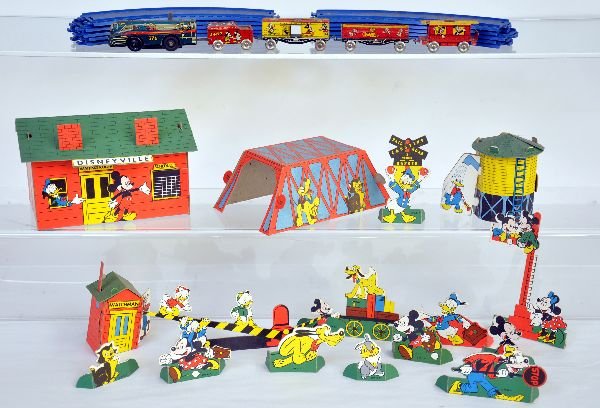 Unusual Marx Disney Train & Village Set: Includes a 5Pc litho tin train, mechanism is functional with plastic snap track. Also includes the scarce paper village with all the Disney characters displayed. Makes a wonderful presentation when as