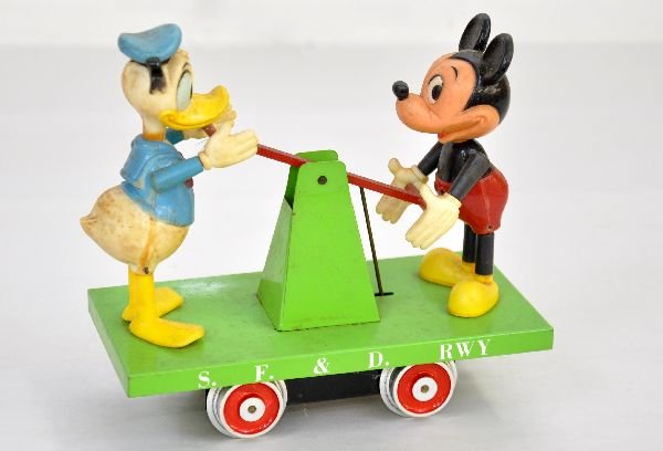 George Templin Mickey & Donald Handcar: Very limited production standard gauge hand car. Tin base with plastic figures & electric motor. It shows light playwear and should clean to C7+