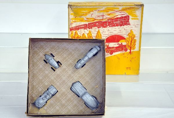Unusual M&L Slush Vehicle Set: Appears to be old Barclay molds. Includes a 5" streamline coupe; locomotive; fire truck & racer, all with Bakelite wheels. They appear like new with set box & worn insert, C8+-9