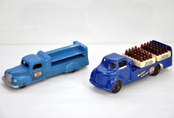 2 Unusual Pepsi Cola Trucks: 6" Tootsietoy International with 95% decals intact; 6" open truck with nice Pepsi decals & two crates, unmarked diecast with rubber tires. Both show light wear and should polish to C8