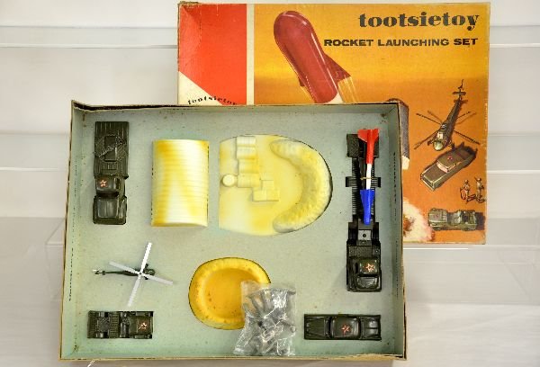 Scarce Boxed Tootsietoy Military Set 4320: Includes mobile rocket launcher, staff car, jeep, helicopter & radar truck, missing screen. It also includes a Vac-u-form missile base pieces & army figures. It appears like new with box & insert stil