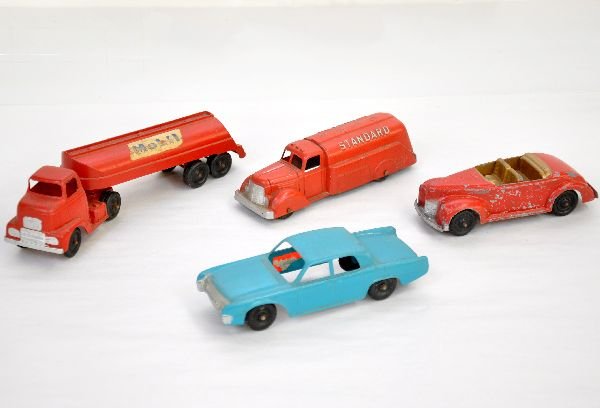 4 Tootsietoy Jumbo Vehicles, Plus: Includes Mobil gas tanker, stickers show wear; Standard fuel truck; Roadster & Hubley Sedan. All are dirty and show light to moderate playwear, may clean to C7 or better