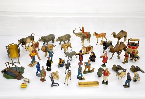45 French Civilians & Farm Figures: Nice assortment including donkey cart, pond with bridge, milkmaid with cow, man blowing fleugal horn, several jungle & wild animals and more. Most show light to moderate playwear, C5-7