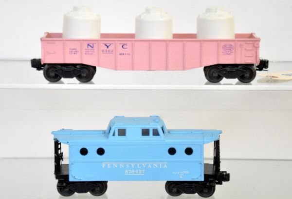 Lionel 6462-500 & 6427-500 Girls Cars: 6462-500 gondola with unlettered canisters. Has small corner ding; 6427-500 N5c caboose, 1 end railing is broken. Both are clean, showing moderate playwear, otherwise C6