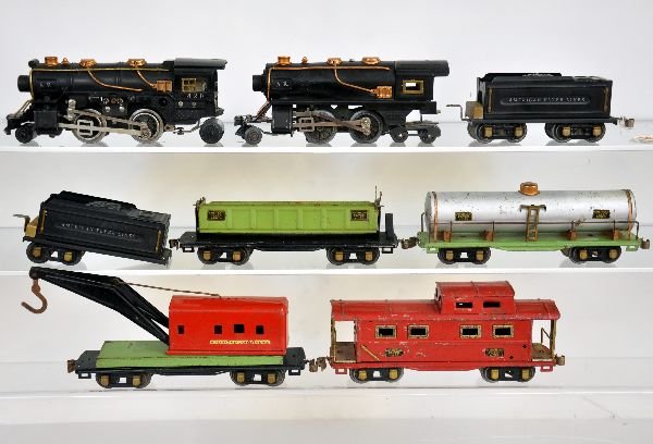 Scarce American Flyer Double Header Set: Includes a 420 cast steam, loco; 3189 tender; 428 dummy tin loco with light; 3189 tender with loose truck, all matching C7+; 3210 tank; 3025 wrecker; 3025 dump car; 3211 caboose, cars show moderate pl