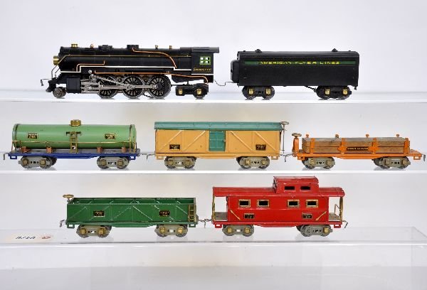 7Pc American Flyer Hudson Freight Set: Includes a 1680 Hudson steam loco, light fatigue to trailing wheels; 1620W whistling tender; 3210 tank car; 3208 boxcar; 3207 sand car; 3206 lumber car with 1 hold-down; 3211 caboose. All show light t