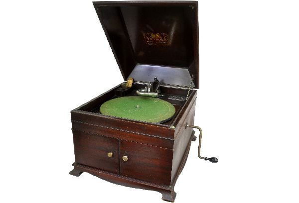 Victor Coffin Top Victrola: 17X20X15" walnut case. It is functional with crank key & parts. Front doors open for speaker. It shows light to moderate playwear and is heavy, so watch shipping costs. Examine photos, or call for mor