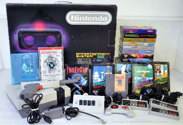 Large Vintage Nintendo Gaming System: Dated 1985, back in the stone age of computers. Includes a boxed consul with different controllers, gun, 4-controller consul and a host of cool games, many with original boxes. While it is untested, i