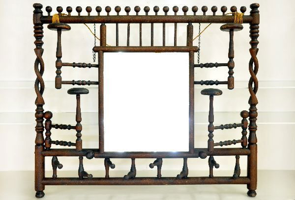 Fantastic Victorian Hat Rack & Mirror: 31x27" Eastlake styling with mahogany bentwood twist side columns. The beveled mirror has an adjustable angle and the 4 hat racks & 7 coat racks pivot for use or store flat into design, very cool. It
