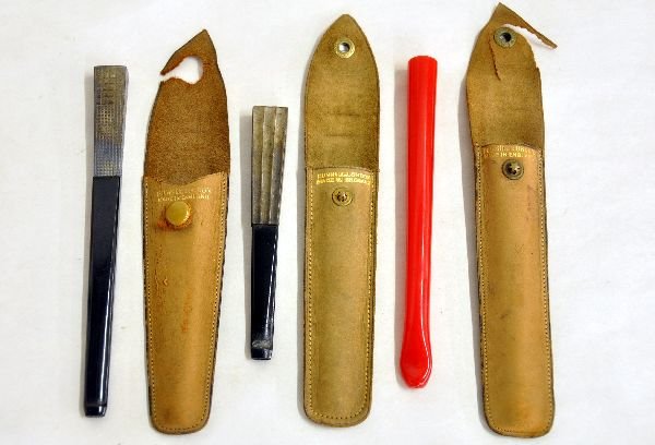 3 Dunhill Art Deco Cigarette Holders: Includes a 5" red Bakelite holder; 5 1/2" plated brass & ebony Bakelite holder, leather case torn; 3 7/8" plated brass fluted holder with ebony Bakelite mouth piece, all have leather holders and show