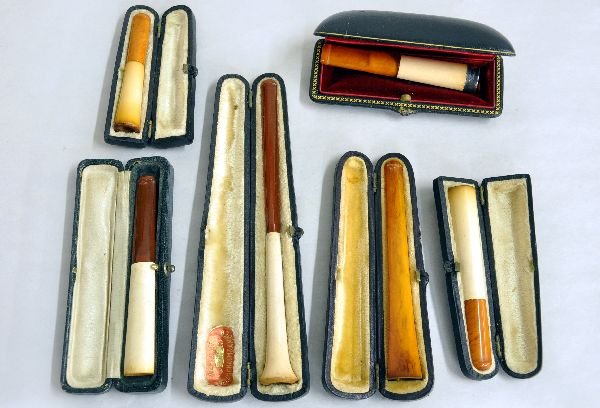 6 Meerschaum & Amber Cigarette Holders: Includes a 6", 4", 3 1/2", 2-3" & 2 7/8" holders, all with Meerschaum ends with amber tips, 1 3" has a silver plated tip (case marked Thilder, Thurber Co Providence); Plus a 4 3/8" amber holder. All h