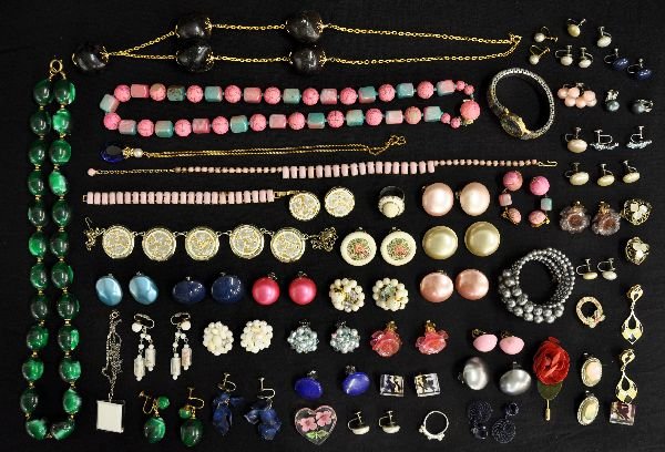 Large Vintage Costume Jewelry Lot: Circa 1950-1970s. Includes 3 necklace & earring sets, necklace & bracelet set; 33 pairs of matched earrings, all clip; Jacque Couture quartz mother of pearl style watch, band missing some inlay; assor