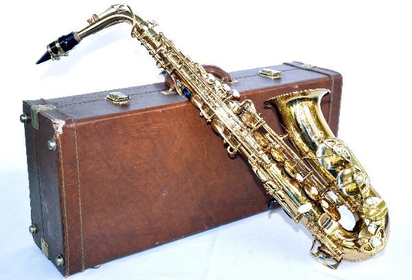 Hermes ll Saxophone: Lacquered brass finish. Shows moderate play wear & light scratches throughout. All components appear to be functional. Comes with hard-shell case and strap. Examine photos or call for more information