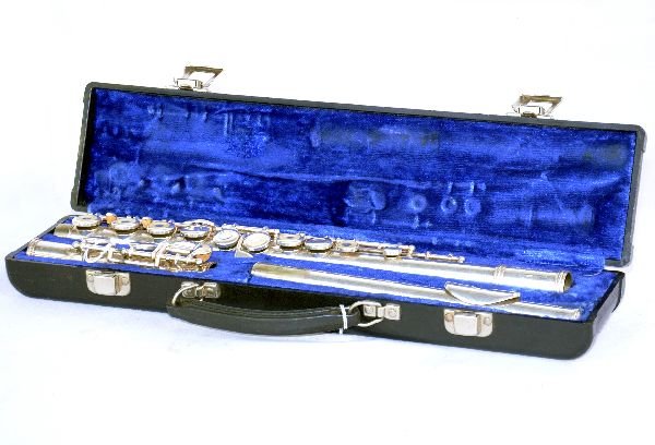 Gemeinhardt Flute 2SP: S/N D72191. Silver plated with considerable play wear & scratches and tarnish throughout. Instruction stickers have been applied to top of keys. All components appear to be in working condition. Inclu