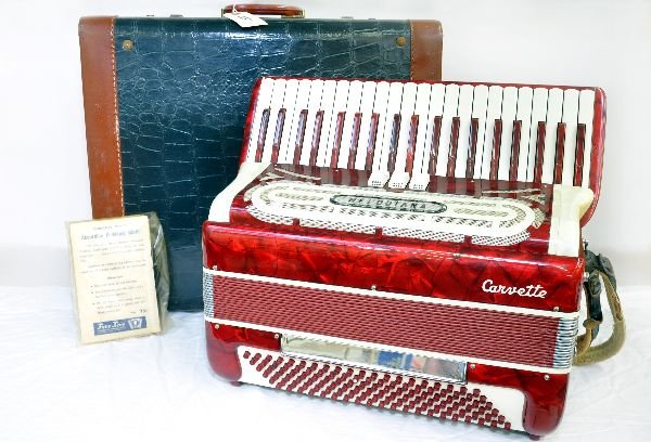 Melodiana Accordion: Italian made, in red pearl finish. It is in near mint condition. Very little play wear. Comes with original case. Examine photos or call for more information, 203 730-1404