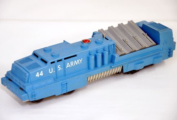 Lionel 44 US Army Rocket Launcher: Clean with all steps intact. It is missing the figure and has a small wedge chip in the front bumper. Paint shows light playwear, otherwise C7 ish