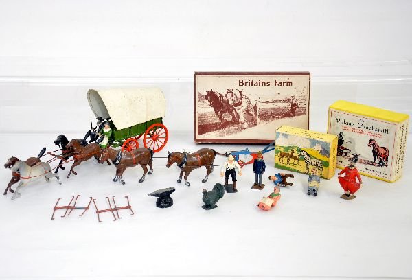 Britains Figure Group: Includes an 11" covered wagon with both riders, top has some spotting, 1 horse missing tail; 6F general purpose plough, complete with insert & wrapping, C9; 691 village blacksmith with box & anvil ONL